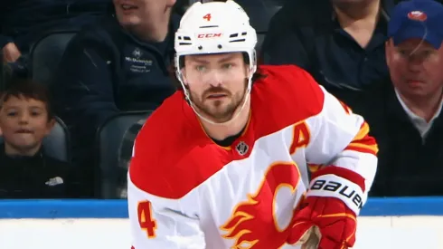Rasmus Andersson #4 of the Calgary Flames skates against the New York Islanders at UBS Arena on March 22, 2025 in Elmont, New York.