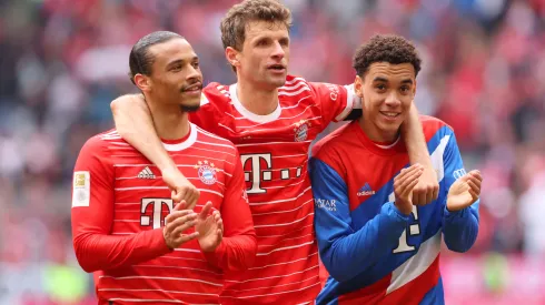 Leroy Sane, Thomas Mueller and Jamal Musiala of FC Bayern Munich celebrate following the team's victory during the Bundesliga match between FC Bayern München and FC Schalke 04 at Allianz Arena on May 13, 2023 in Munich, Germany.