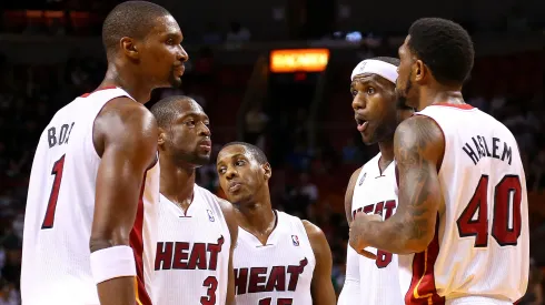 LeBron James #6 of the Miami Heat talks with Dwyane Wade #3, Chris Bosh #1, Mario Chalmers #15 and Udonis Haslem #40 during a game against the Golden State Warriors at American Airlines Arena on December 12, 2012 in Miami, Florida.