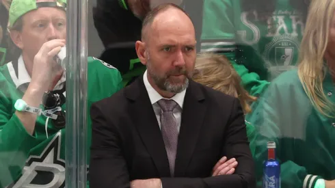 Former Dallas Stars head coach Peter DeBoer looks on from behind the bench during a 2024 NHL game, prior to being relieved of his duties after two seasons with the team.