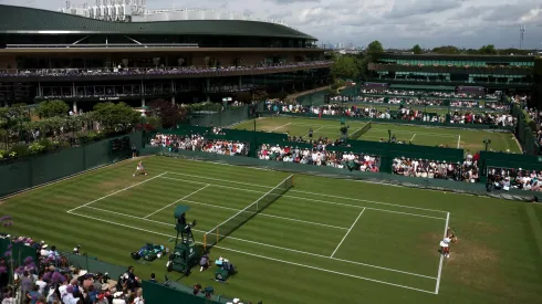 A general view over Court 14 as Leylah Fernandez of Canada serves against Laura Siegemund of Germany during the Ladies' Singles second round match on day three of The Championships Wimbledon 2025.