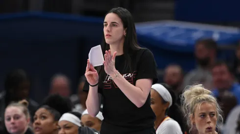 Indiana Fever's Caitlin Clark cheers from the sidelines