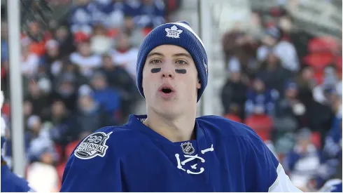 Mitchell Marner #16 of the Toronto Maple Leafs watches a flying puck in the warm-up prior to play against the Detroit Red Wings during the 2017 Scotiabank NHL Centennial Classic at BMO Field On January 1, 2017 in Toronto, Ontario, Canada.