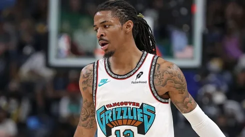 Ja Morant #12 of the Memphis Grizzlies handles the ball against the Dallas Mavericksduring the second half of the Play-In Tournament at FedExForum on April 18, 2025 in Memphis, Tennessee.