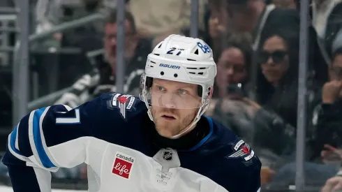 Nikolaj Ehlers #27 of the Winnipeg Jets passes during a 4-1 loss to the Los Angeles Kings at Crypto.com Arena on April 01, 2025 in Los Angeles, California.