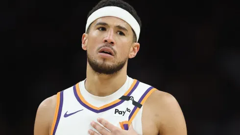 Devin Booker #1 of the Phoenix Suns reacts during the second half of the NBA game against the San Antonio Spurs at PHX Arena on April 11, 2025 in Phoenix, Arizona.