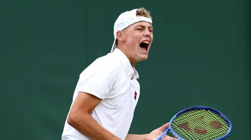 Cruz Hewitt celebrates a break point against Savva Rybkin during the Boy's Singles first round match
