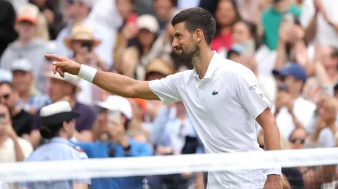 Novak Djokovic of Serbia points towards the Royal Box after winning match point against Alex De Minaur of Australia during the Gentlemen's Singles fourth round match on day eight of The Championships Wimbledon 2025.
