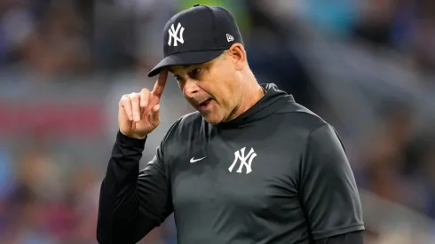 Aaron Boone of the New York Yankees walks back to the dugout after making a pitching change in the fifth inning against the Toronto Blue Jays in their MLB game at the Rogers Centre on July 3, 2025 in Toronto, Ontario, Canada.