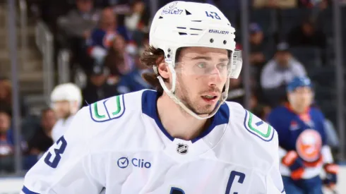 Quinn Hughes #43 of the Vancouver Canucks skates against the New York Islanders at UBS Arena on March 26, 2025 in Elmont, New York.