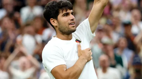 Carlos Alcaraz of Spain acknowledges the crowd as he celebrates following his victory against Andrey Rublev during Wimbledon.