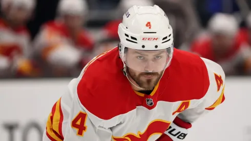 Rasmus Andersson #4 of the Calgary Flames looks on during the first period against the Seattle Kraken at Climate Pledge Arena on February 02, 2025 in Seattle, Washington.