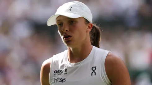 Iga Swiatek of Poland reacts against Amanda Anisimova of United States during Wimbledon final.