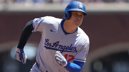 Shohei Ohtani #17 of the Los Angeles Dodgers rounds third base to score on an rbi double hit by Freddie Freeman #5 of the Los Angeles Dodgers.
