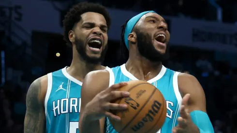 Josh Okogie #12 and Miles Bridges #0 of the Charlotte Hornets react during the second half of the game against the Los Angeles Lakers.