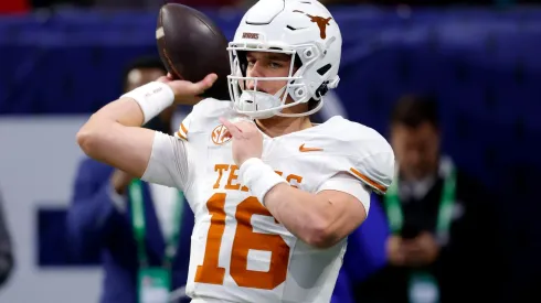 Arch Manning #16 of the Texas Longhorns warms up prior to the 2024 SEC Championship against the Georgia Bulldogs at Mercedes-Benz Stadium on December 07, 2024 in Atlanta, Georgia.