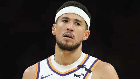 Devin Booker #1 of the Phoenix Suns reacts during the second half of the NBA game against the San Antonio Spurs at PHX Arena on April 11, 2025 in Phoenix, Arizona.