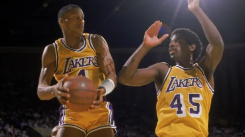 Byron Scott #4 of the Los Angeles Lakers grabs a rebound during an NBA game against the Houston Rockets at the Great Western Forum in Los Angeles.