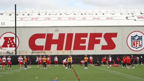 Chiefs players stretch on the field before the Kansas City Chiefs OTAs at The University of Kansas Health System Training Complex on May 29, 2025.