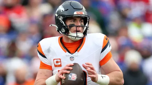 Bo Nix #10 of the Denver Broncos scrambles in the second quarter against the Buffalo Bills during the AFC Wild Card Playoffs at Highmark Stadium on January 12, 2025 in Orchard Park, New York.