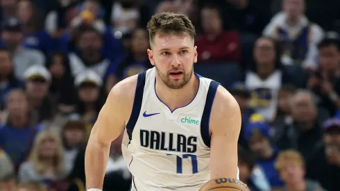 Luka Doncic #77 of the Dallas Mavericks dribbles the ball against the Golden State Warriors