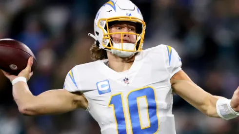 Justin Herbert #10 of the Los Angeles Chargers throws a pass against the Jacksonville Jaguars during the first half of the game in the AFC Wild Card playoff game at TIAA Bank Field on January 14, 2023 in Jacksonville, Florida.