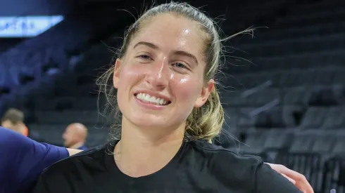 Former Iowa Hawkeyes teammates Caitlin Clark (L) #22 of the Indiana Fever and Kate Martin #20 of the Las Vegas Aces greet each other on the court during warmups before their game at Michelob ULTRA Arena on May 25, 2024.