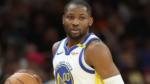 Jonathan Kuminga #00 of the Golden State Warriors handles the ball during the NBA game at PHX Arena on April 08, 2025 in Phoenix, Arizona.