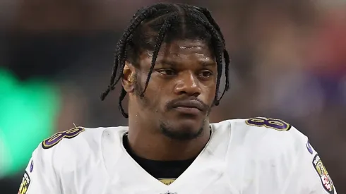 Quarterback Lamar Jackson #8 of the Baltimore Ravens holds a Microsoft surface on the sidelines during the NFL game at Allegiant Stadium on September 13, 2021 in Las Vegas, Nevada. The Raiders defeated the Ravens 33-27 in overtime.