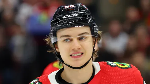 Connor Bedard #98 of the Chicago Blackhawks laughs against the Colorado Avalanche during the second period at the United Center on December 19, 2023 in Chicago, Illinois.