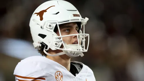 Arch Manning #16 of the Texas Longhorns warms up before the game against the Texas A&M Aggies at Kyle Field on November 30, 2024 in College Station, Texas.