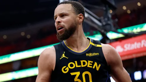 Stephen Curry #30 of the Golden State Warriors reacts against the Houston Rockets after making a shot during the fourth quarter in Game Seven of the Western Conference First Round NBA Playoffs.