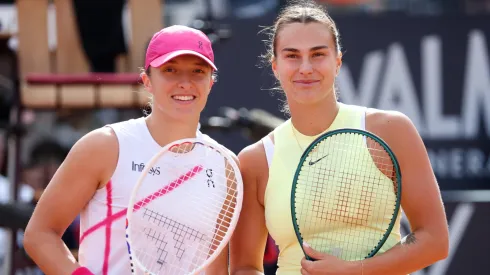 Iga Swiatek of Poland and Aryna Sabalenka pose at the net before their Women's Singles Final Match during Day 13 of the Internazionali BNL D'Italia 2024.
