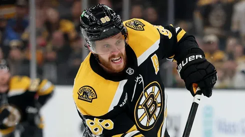 David Pastrnak skates during a Boston Bruins game as contract controversy surrounds the team.
