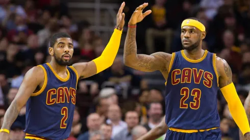 Kyrie Irving #2 and LeBron James #23 of the Cleveland Cavaliers celebrate during the first half against the Golden State Warriors at Quicken Loans Arena on February 26, 2015.