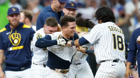 Isaac Collins #6 of the Milwaukee Brewers celebrates his walk-off home run with Anthony Seigler #18 in the ninth inning against the New York Mets.