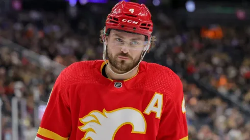 Rasmus Andersson #4 of the Calgary Flames waits for a faceoff in the second period of a game against the Vegas Golden Knights at T-Mobile Arena on January 13, 2024 in Las Vegas, Nevada. The Flames defeated the Golden Knights 3-1.
