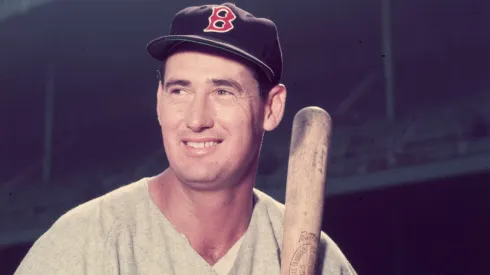 Baseball legend Ted Williams (1918 – 2002) of the Boston Red Sox holds a bat circa 1955.