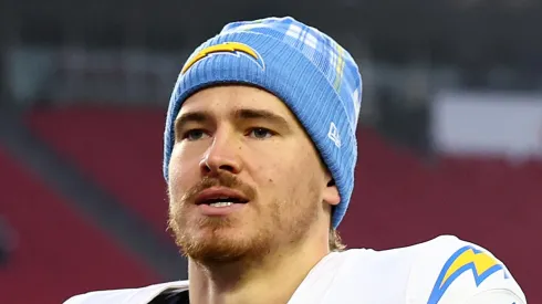 Justin Herbert #10 of the Los Angeles Chargers runs off of the field after the game against the New England Patriots at Gillette Stadium on December 28, 2024 in Foxborough, Massachusetts.