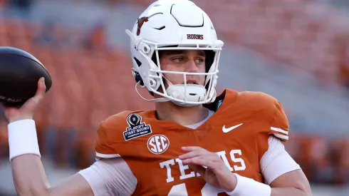 Arch Manning of the Texas Longhorns warms up prior to a game against the Clemson Tigers.