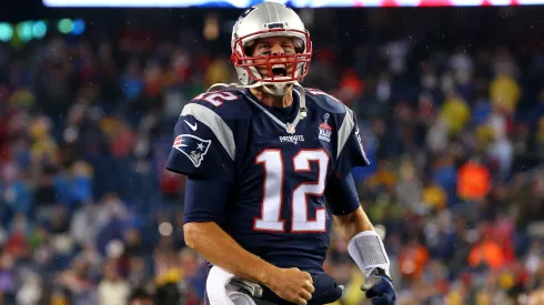 Tom Brady #12 of the New England Patriots cheers as he runs on to the field before the game against the Pittsburgh Steelers in 2015.
