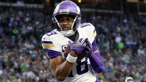 Justin Jefferson #18 of the Minnesota Vikings catches a touchdown pass.