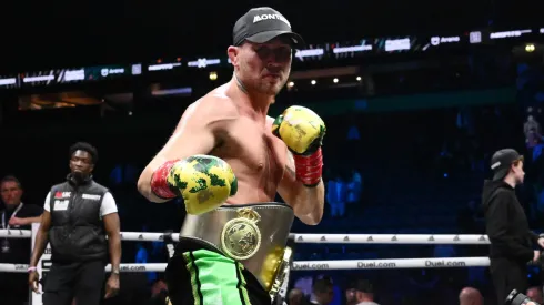 Darren Till celebrates with his belt after victory in the Light Heavyweight fight between Darren Till against Luke Rockhold