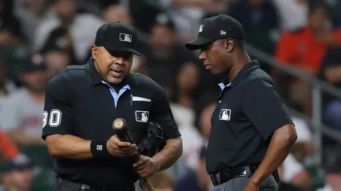 Umpires Adrian Johnson and Ramon De Jesus examine Taylor Trammell's bat on September 04, 2025 in Houston.