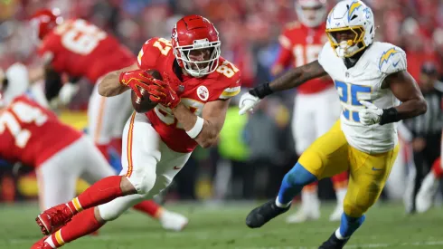 Travis Kelce #87 of the Chiefs is chased by Junior Colson #25 of the Chargers during the second quarter in 2024.