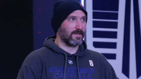 Alex Ovechkin holds a Bud Light prior to a press conference.