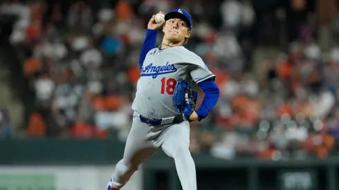 Yoshinobu Yamamoto #18 of the Los Angeles Dodgers throws a pitch.