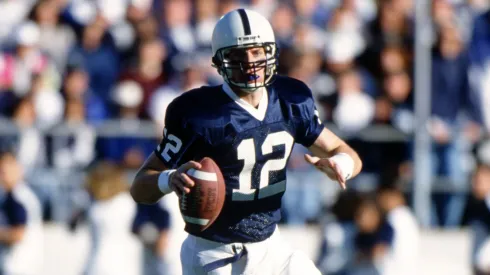 Kerry Collins rolls out of the pocket while looking for an open receiver in 1994.