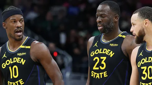 Jimmy Butler #10, Draymond Green #23 and Stephen Curry #30 of the Golden State Warriors.