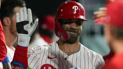 Bryce Harper celebrates with teammates.